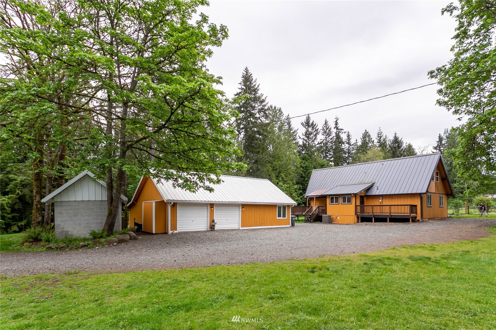 15722 240th Street East Graham, WA 98338 - Photo 5 of 40 a view of house with outdoor space and sitting area