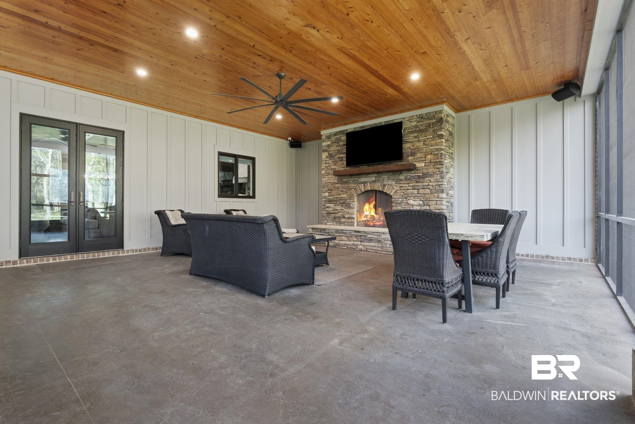 9501 Ben Hamilton Road Theodore, AL 36582 - Photo 60 of 69 View of patio / terrace with a fireplace, a ceiling fan, and an outdoor living / dining area