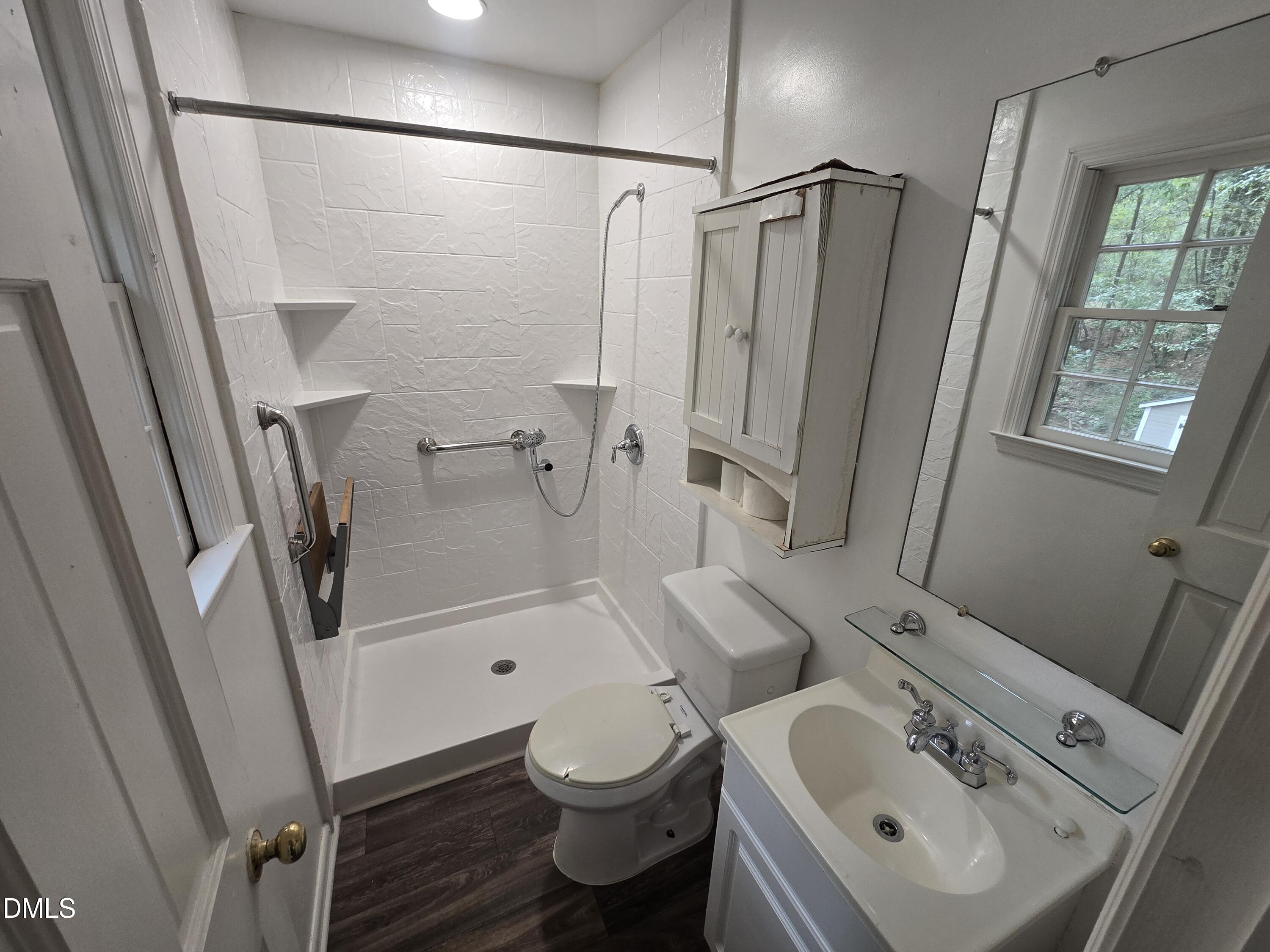 4311 Pope Road Durham, NC 27707 - Photo 21 of 23 a bathroom with a sink toilet and shower