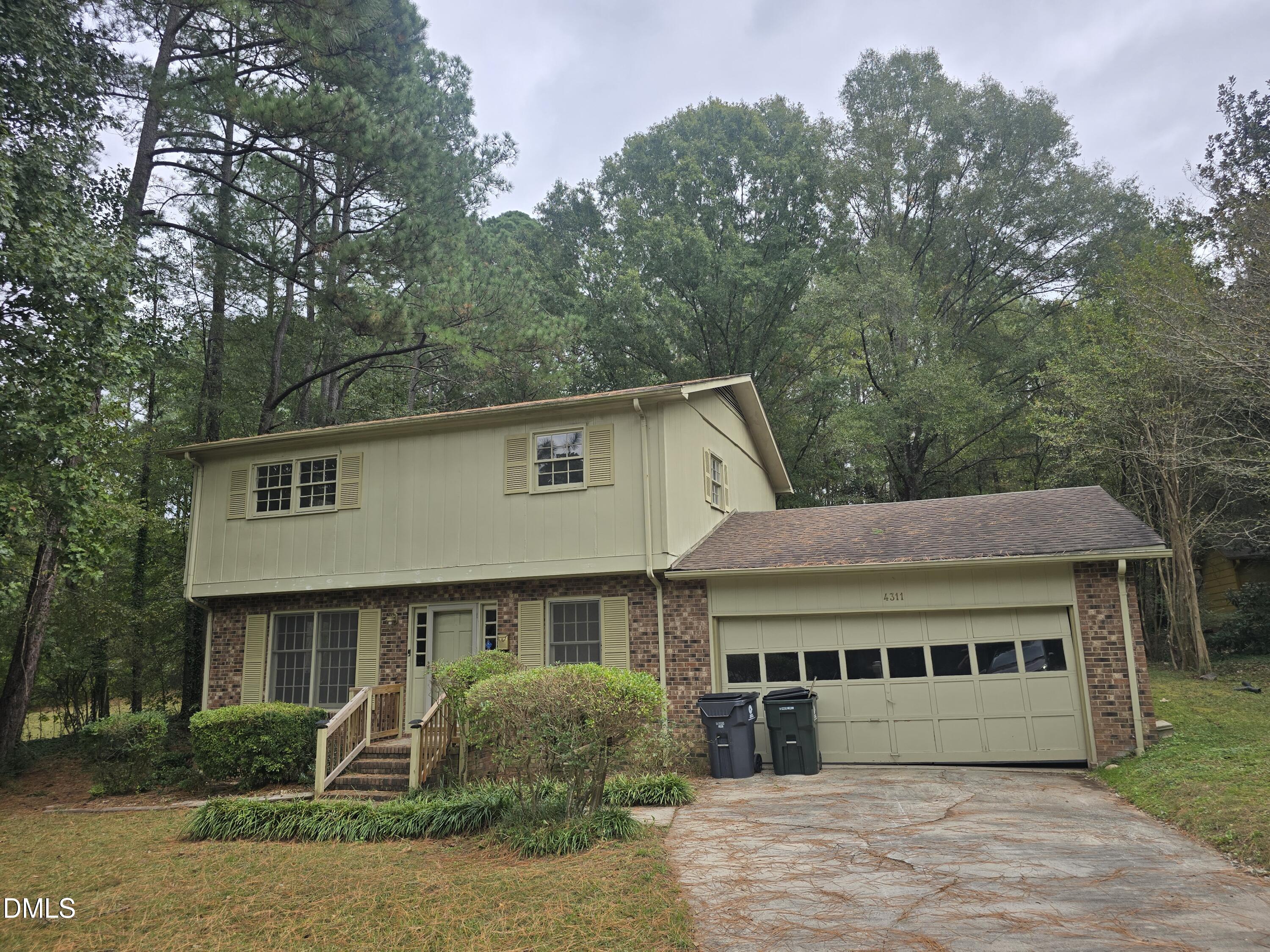 4311 Pope Road Durham, NC 27707 - Photo 23 of 23 a front view of a house with garden