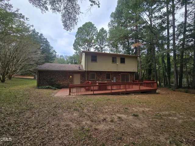a view of a house with a back yard