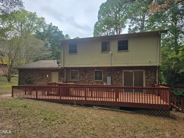 a view of a house with a fence