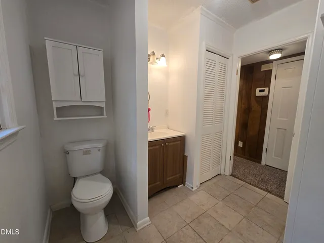 a bathroom with a toilet sink and tub