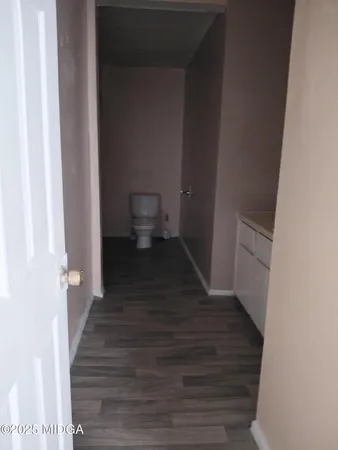 a view of a bathroom from the hallway