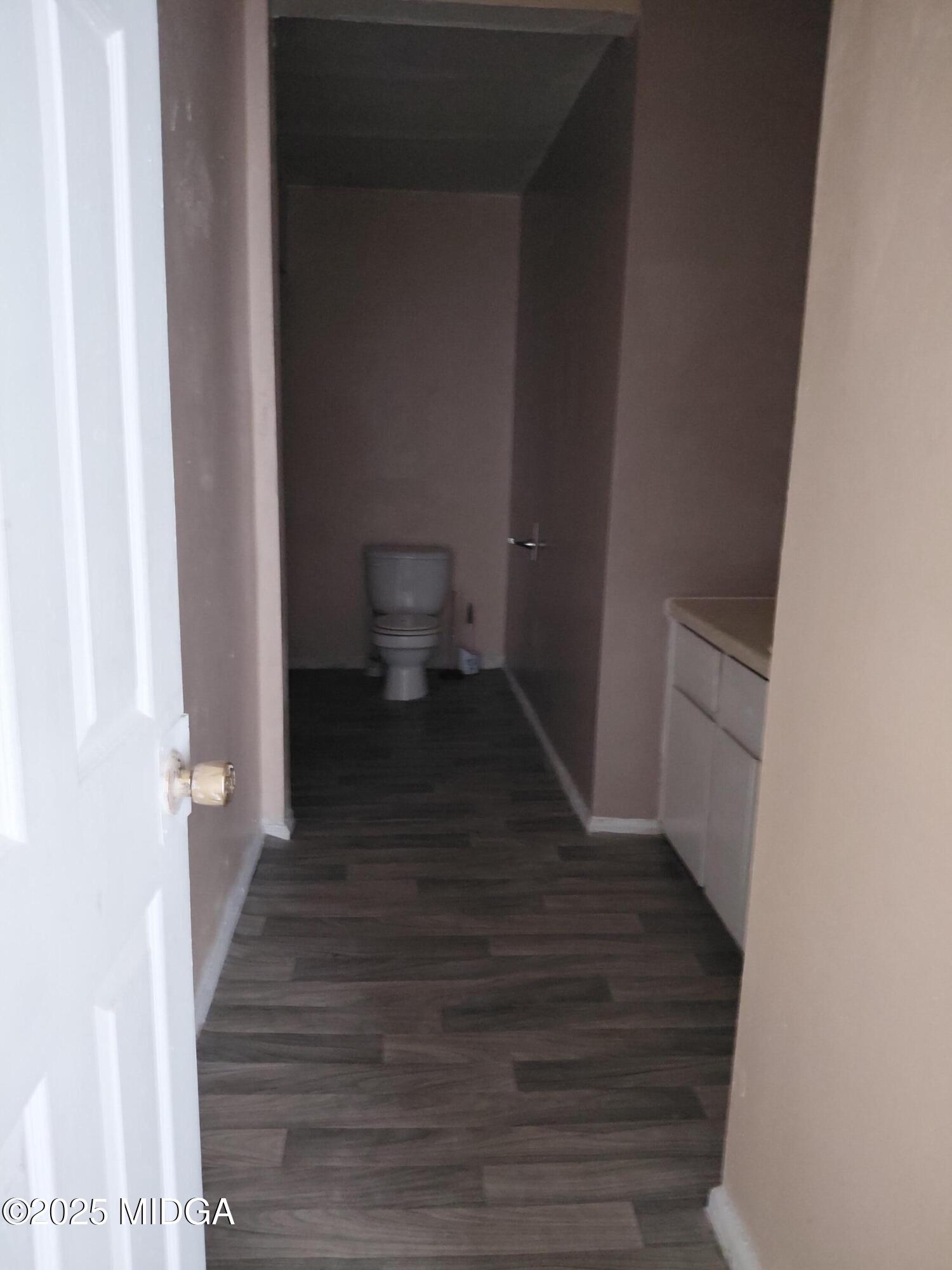 3828 Lyons Street Macon, GA 31206 - Photo 5 of 8 a view of a bathroom from the hallway