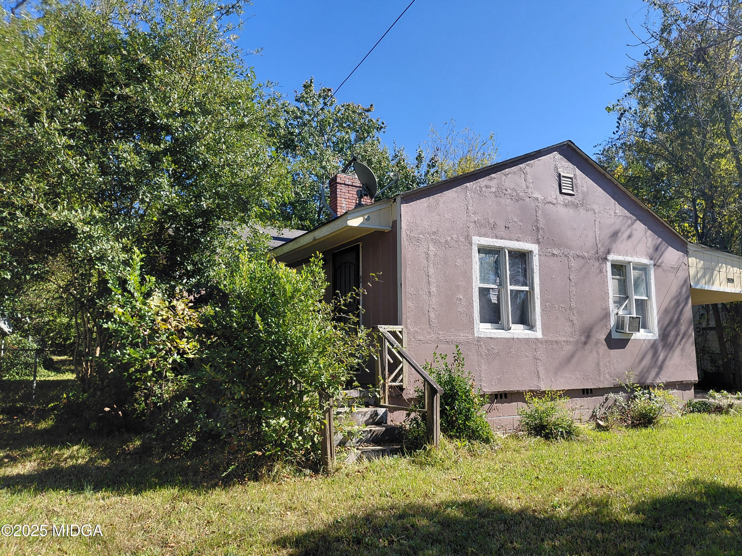 3828 Lyons Street Macon, GA 31206 - Photo 6 of 8 a aerial view of a house with a yard