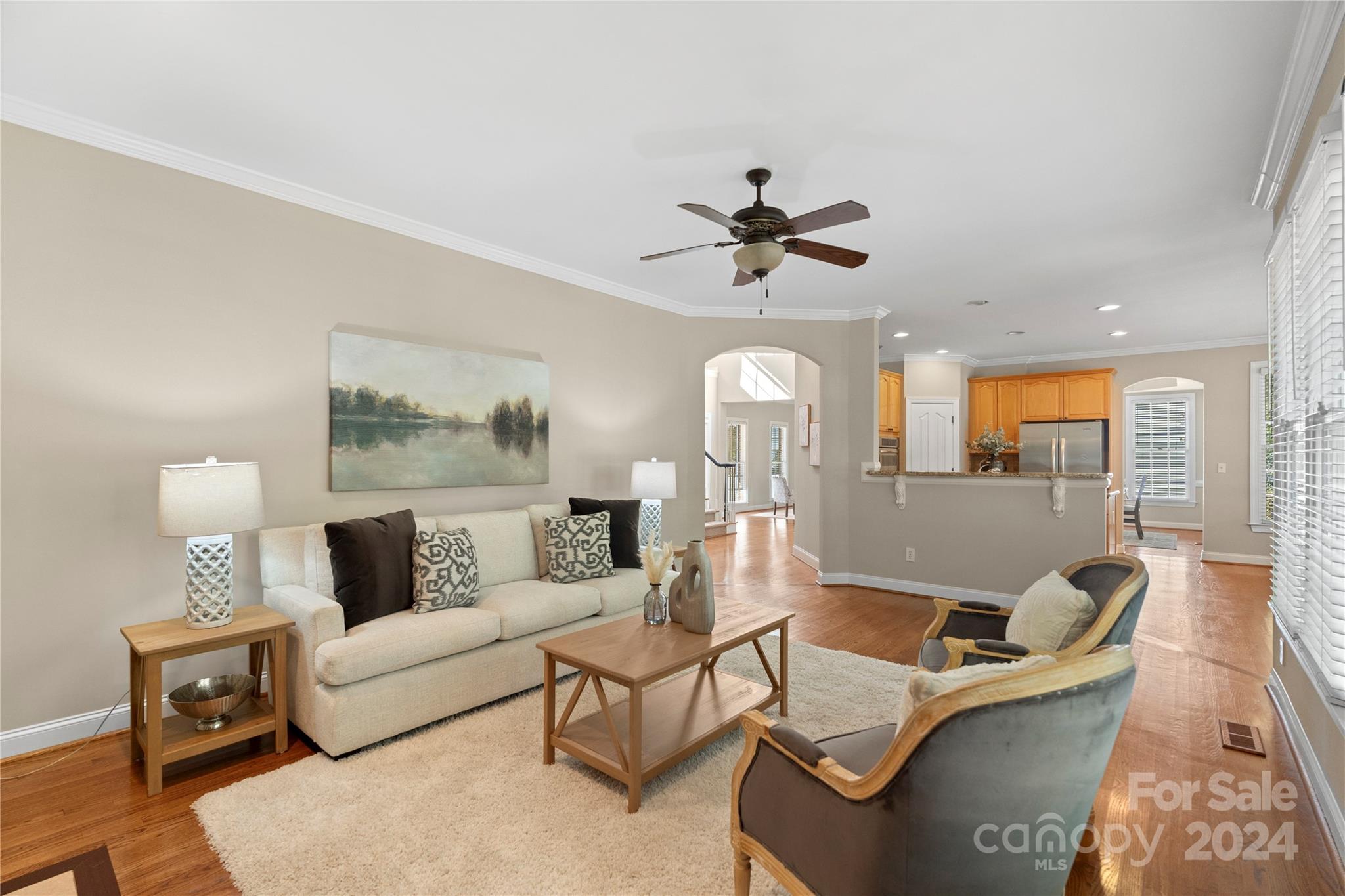 3417 Rhett Butler Place Charlotte, NC 28270 - Photo 17 of 48 a living room with furniture and a chandelier
