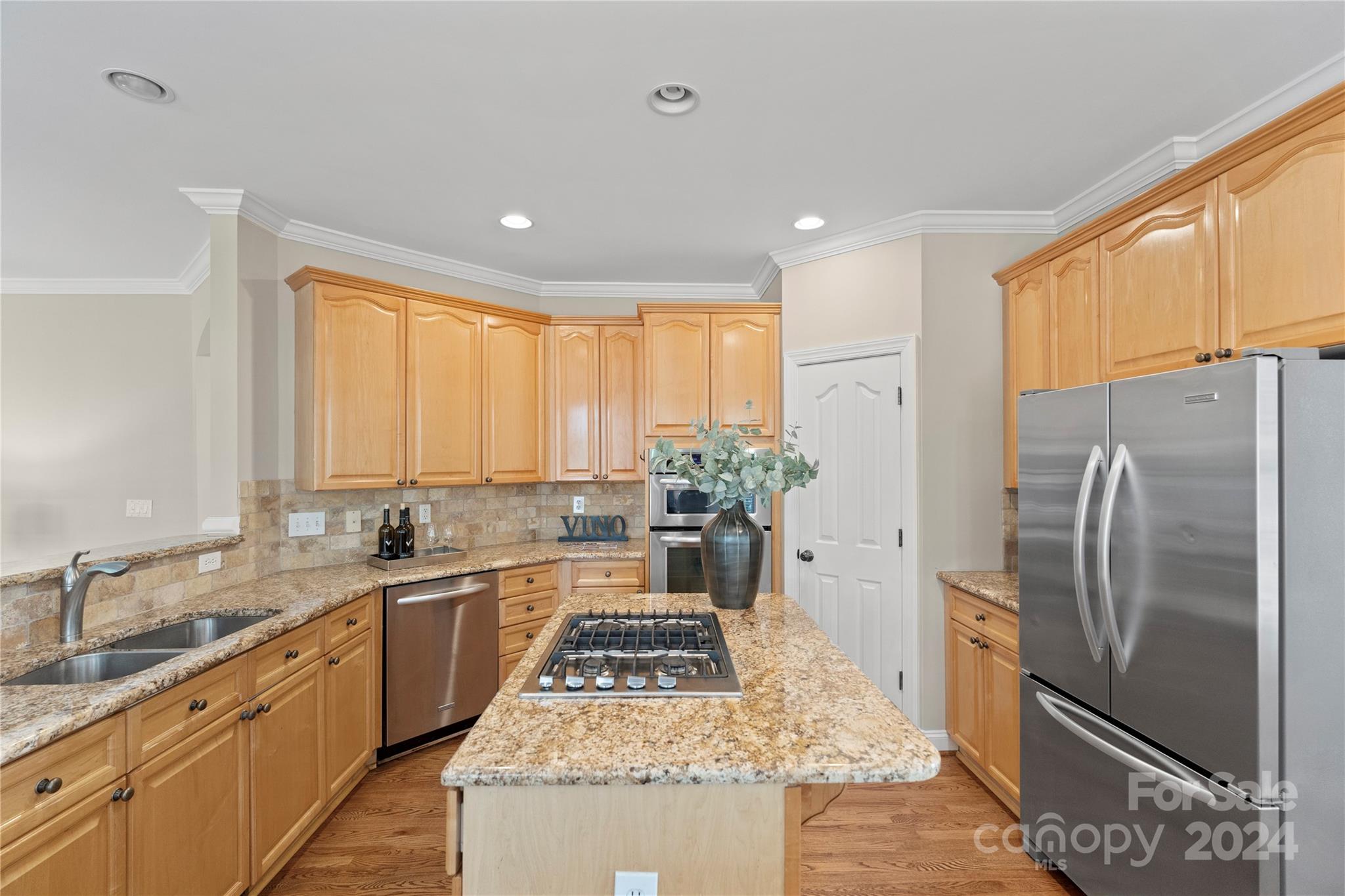 3417 Rhett Butler Place Charlotte, NC 28270 - Photo 18 of 48 a kitchen with stainless steel appliances granite countertop a sink stove and refrigerator
