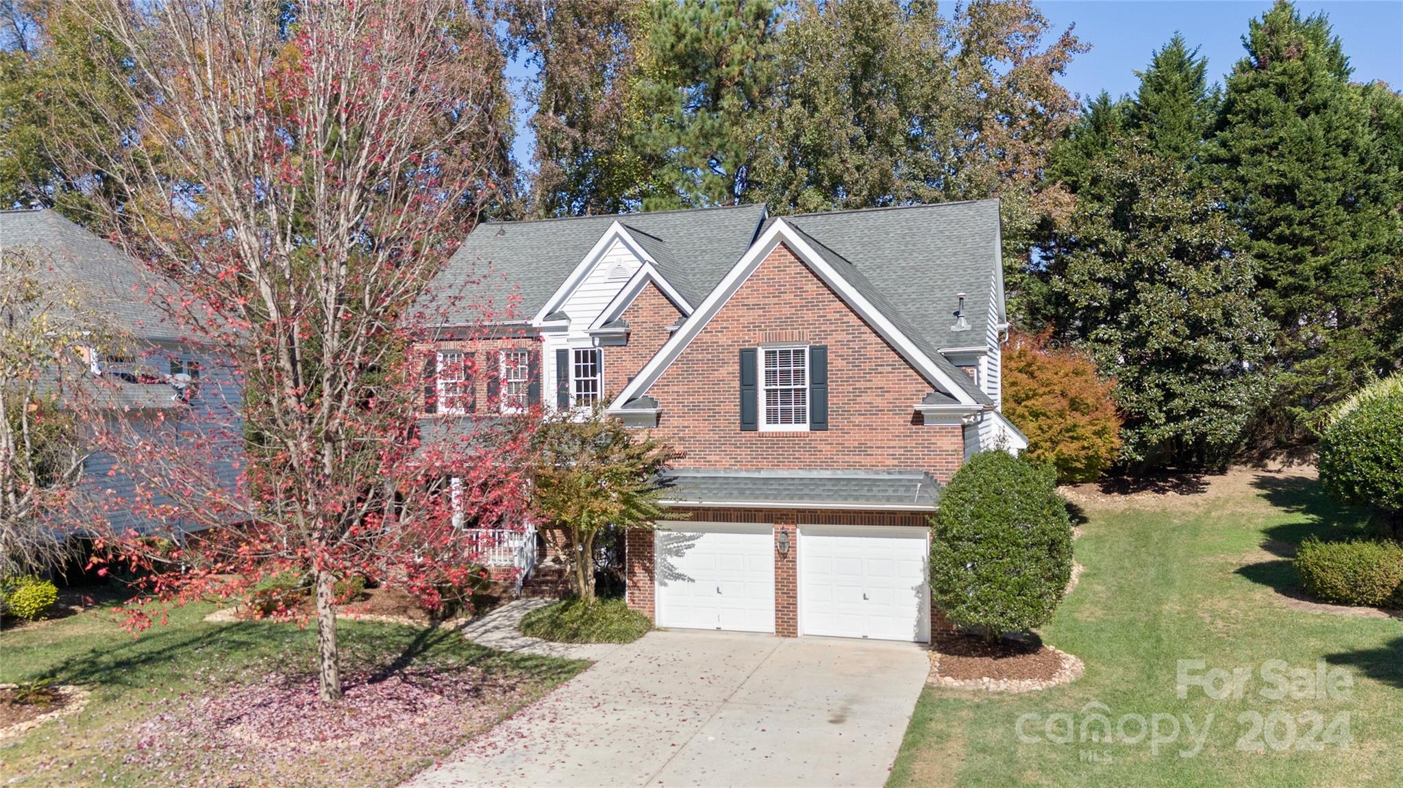 3417 Rhett Butler Place Charlotte, NC 28270 - Photo 2 of 48 a front view of a house with a garden