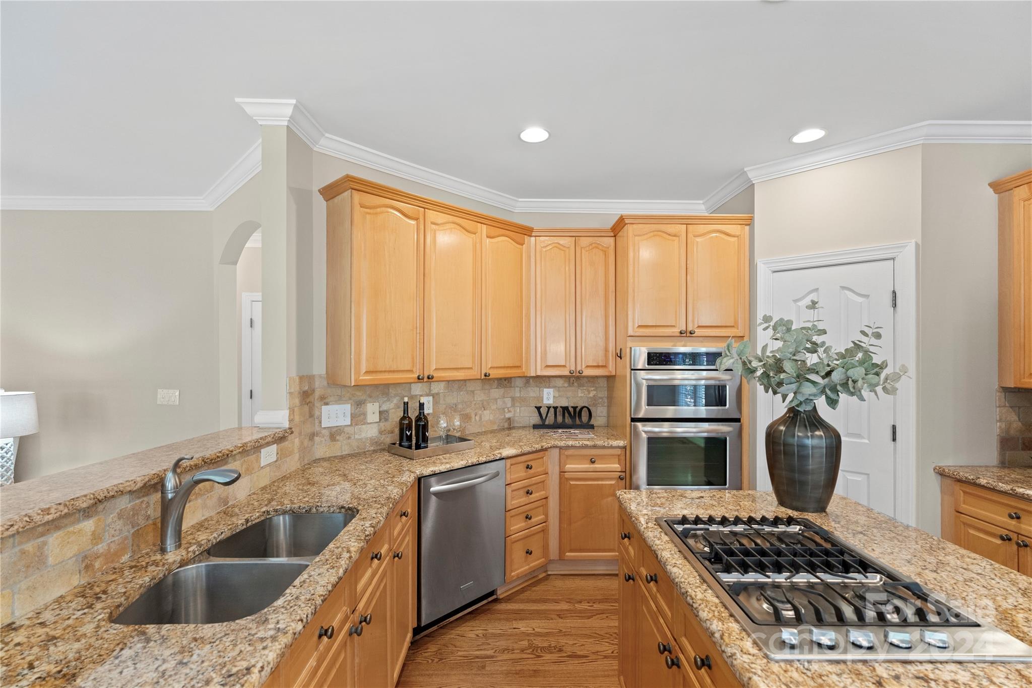 3417 Rhett Butler Place Charlotte, NC 28270 - Photo 21 of 48 a kitchen with a sink stove and refrigerator