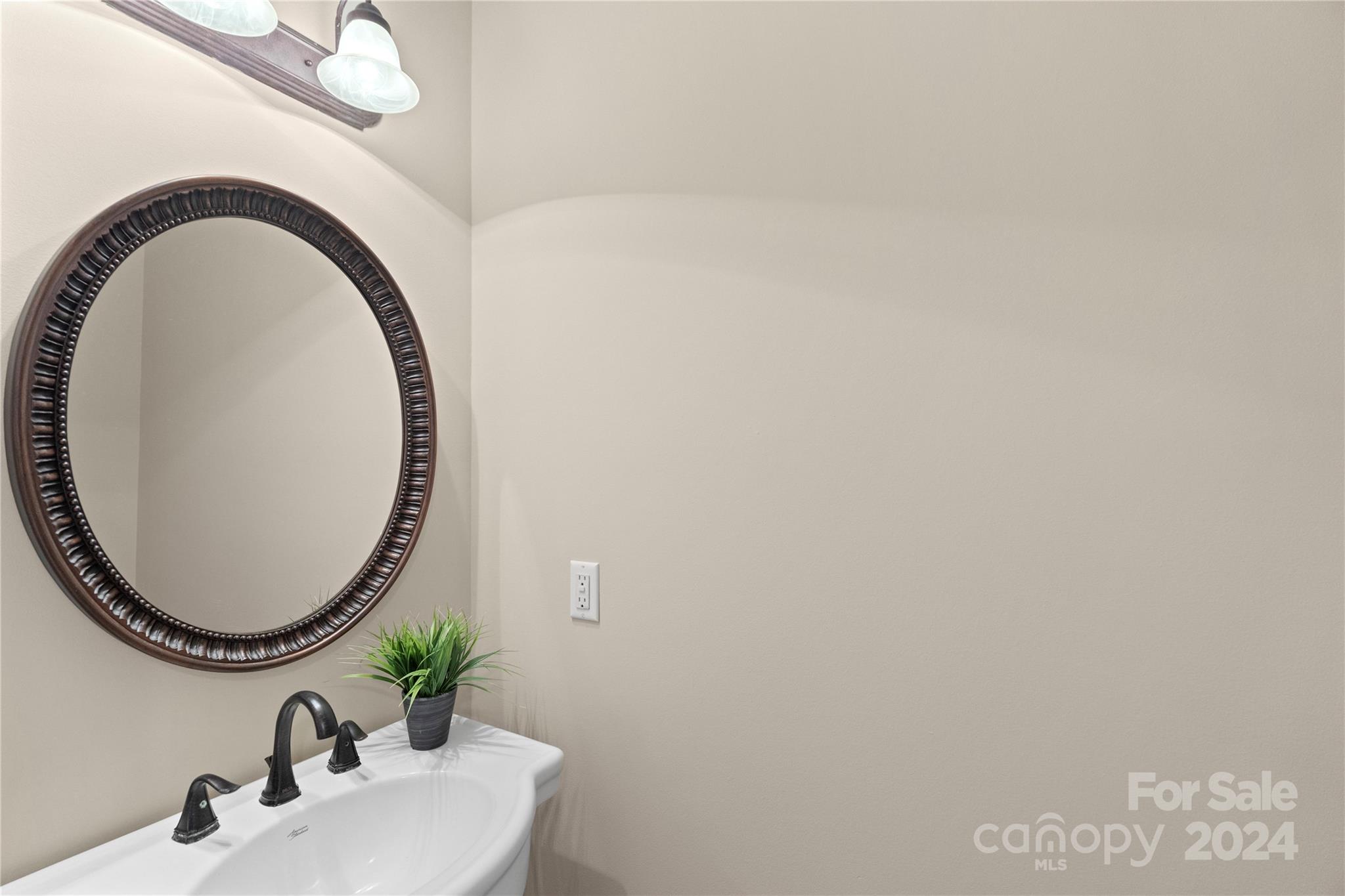 3417 Rhett Butler Place Charlotte, NC 28270 - Photo 25 of 48 a bathroom with a sink and a mirror