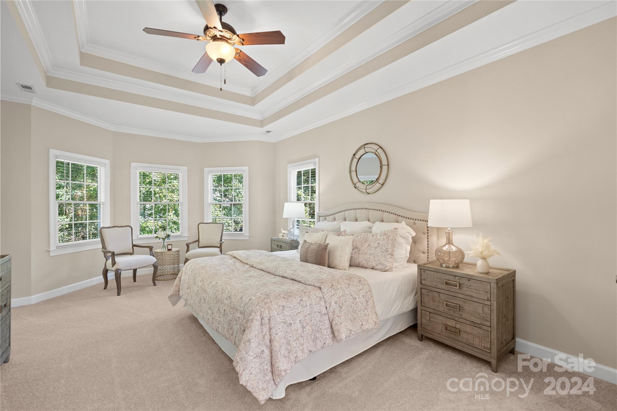 3417 Rhett Butler Place Charlotte, NC 28270 - Photo 27 of 48 a bedroom with bed and a chandelier