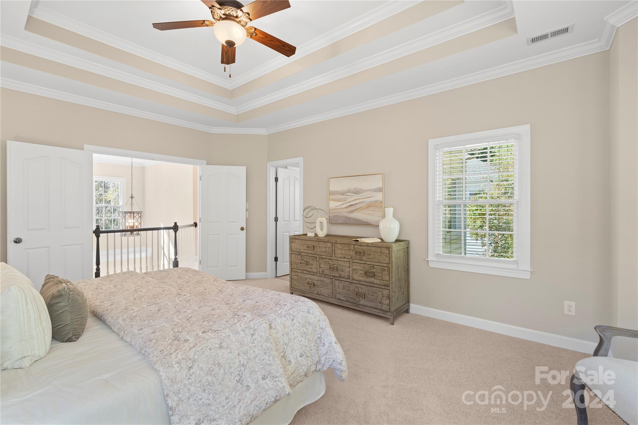 3417 Rhett Butler Place Charlotte, NC 28270 - Photo 29 of 48 a bedroom with a bed chandelier and a window