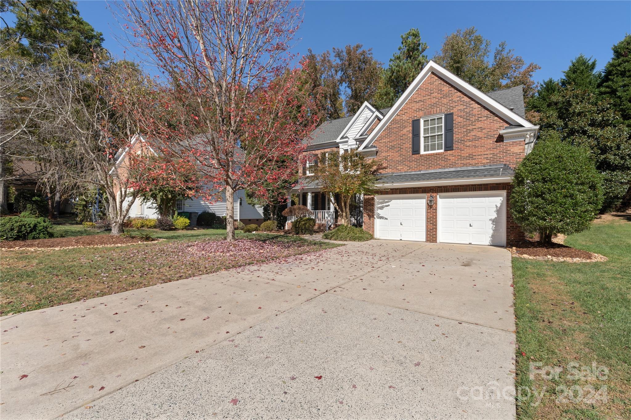 3417 Rhett Butler Place Charlotte, NC 28270 - Photo 3 of 48 a front view of a house with a yard and garage