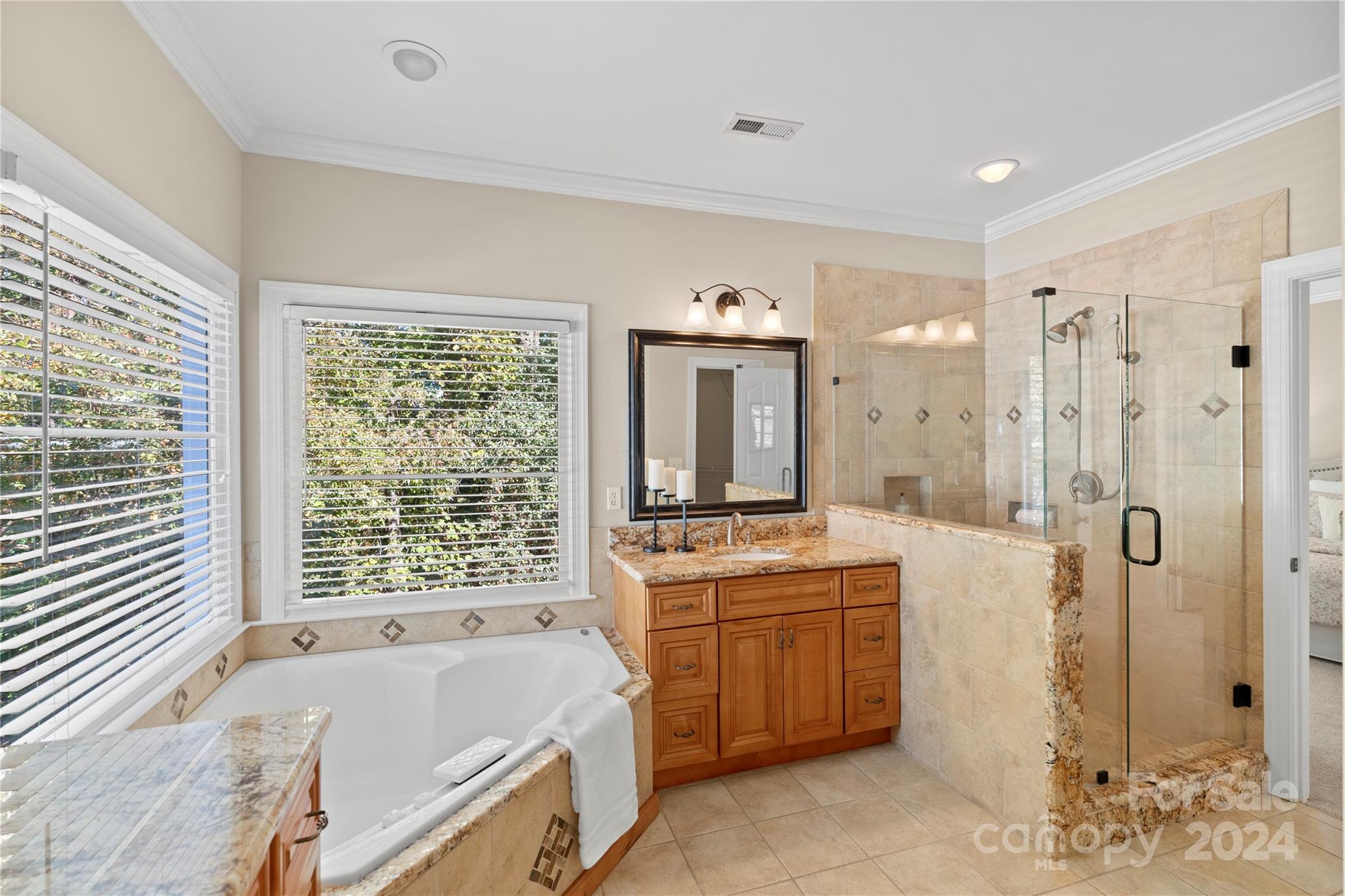 3417 Rhett Butler Place Charlotte, NC 28270 - Photo 31 of 48 a spacious bathroom with a tub sink shower and mirror