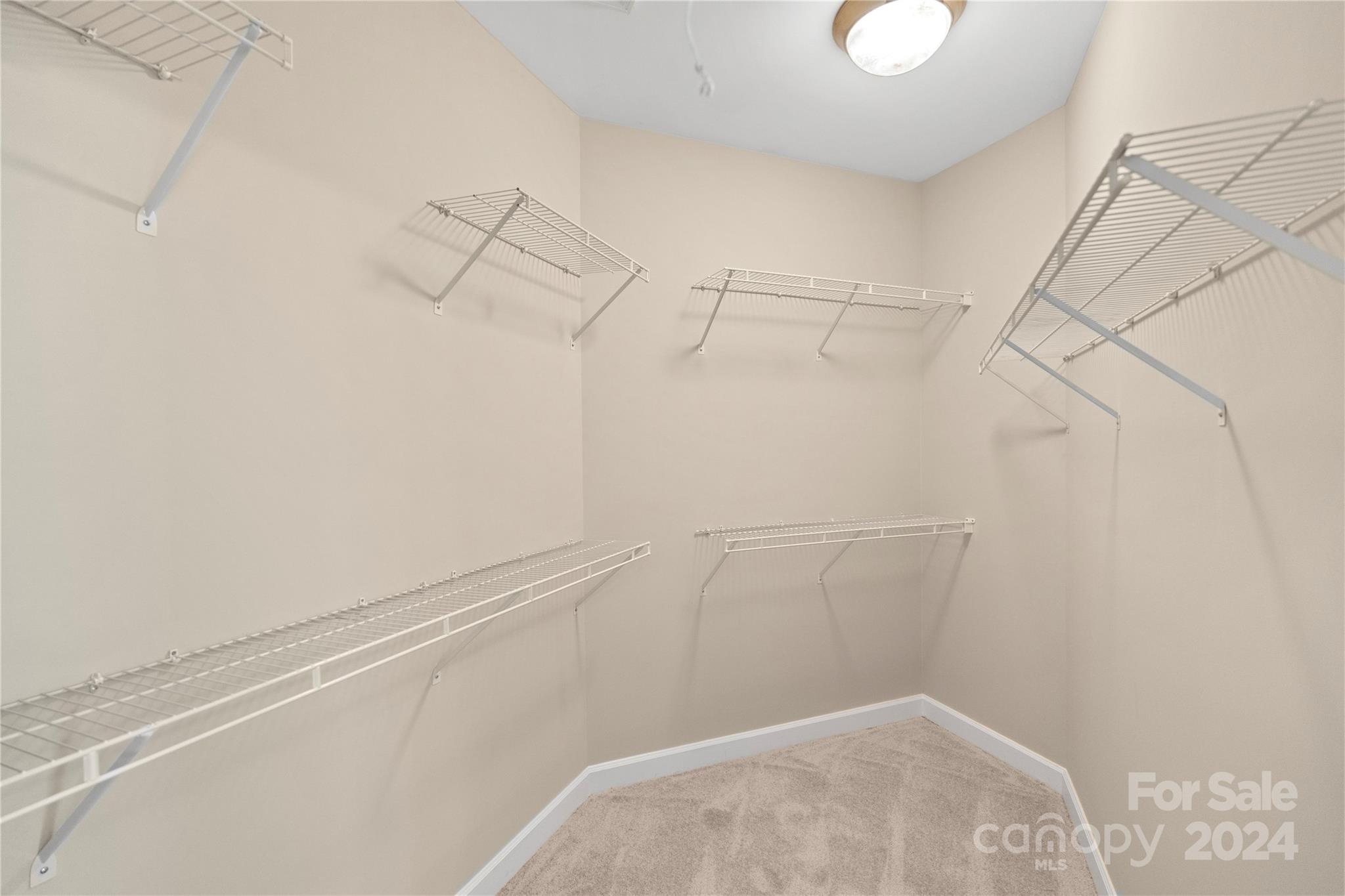 3417 Rhett Butler Place Charlotte, NC 28270 - Photo 33 of 48 a view of a room with racks on the wall