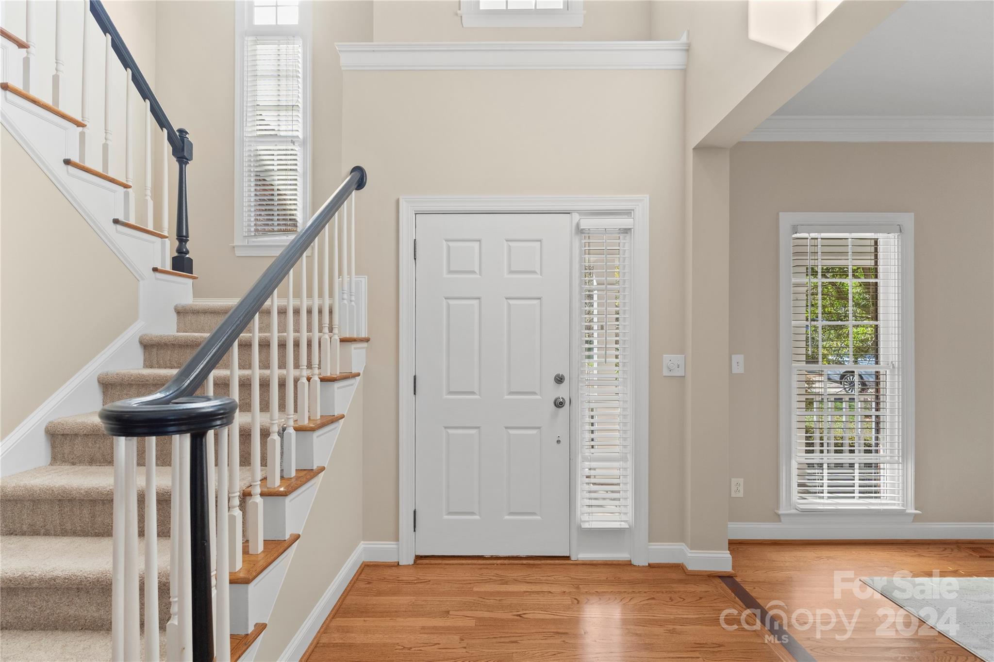 3417 Rhett Butler Place Charlotte, NC 28270 - Photo 7 of 48 a view of front door with wooden floor and stairs