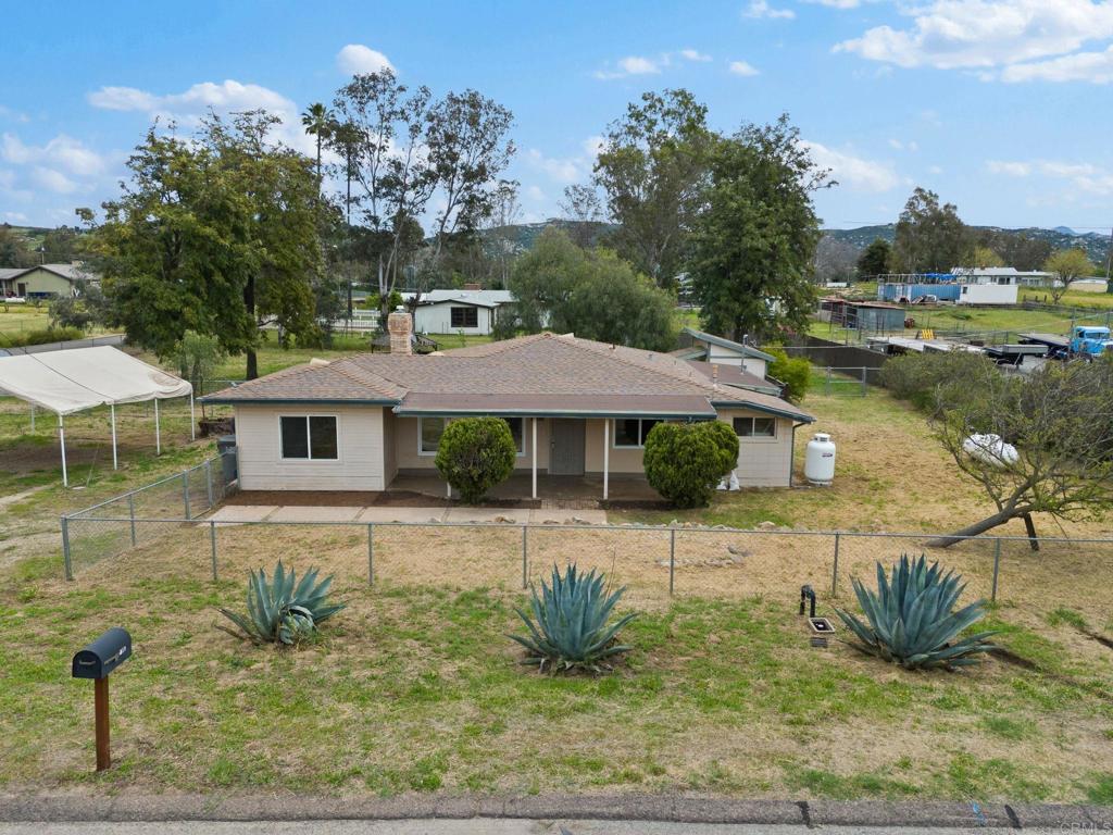 1565 Lilac Road Ramona, CA 92065 - Photo 1 of 1 a front view of a house with garden