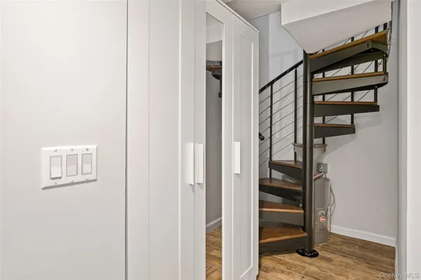 a view of front door with wooden floor