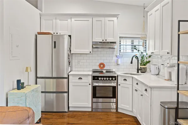 a kitchen with cabinets and appliances