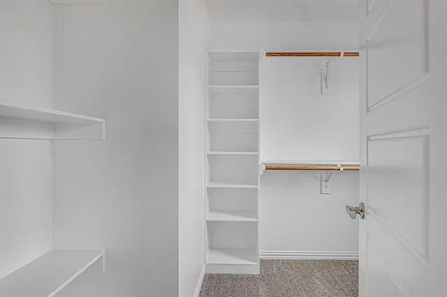 a view of an empty walk in closet