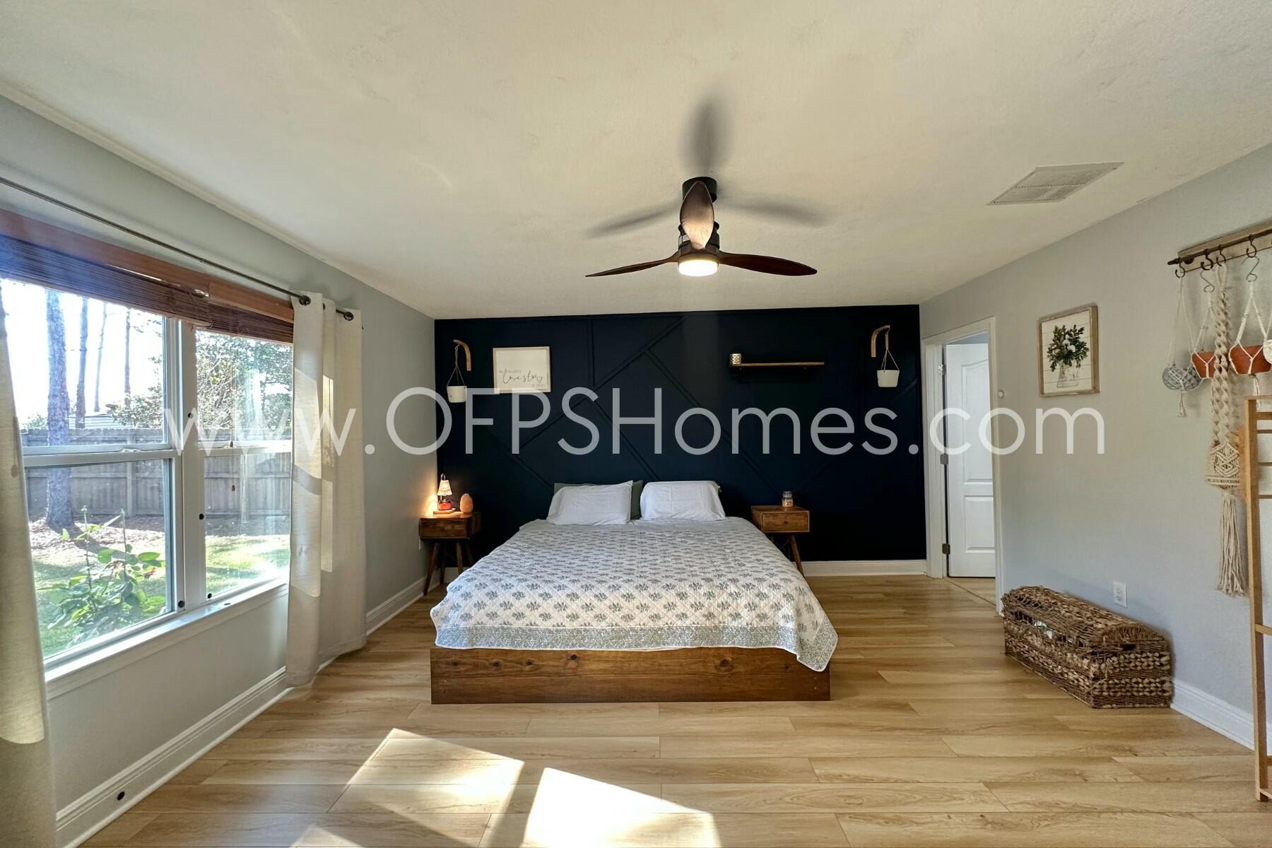 2400 Avenida De Sol Navarre, FL 32566 - Photo 13 of 42 a bedroom with a bed and window