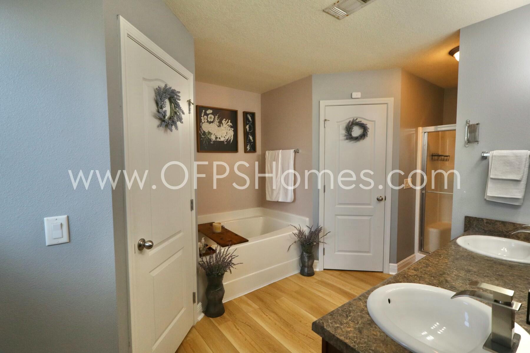 2400 Avenida De Sol Navarre, FL 32566 - Photo 16 of 42 a bathroom with a sink toilet and shower