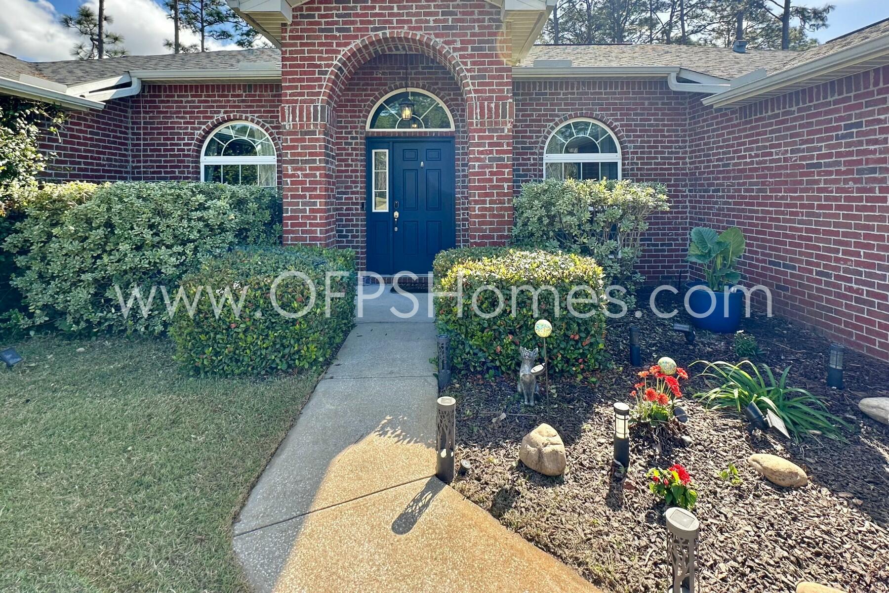 2400 Avenida De Sol Navarre, FL 32566 - Photo 2 of 42 a front view of a house