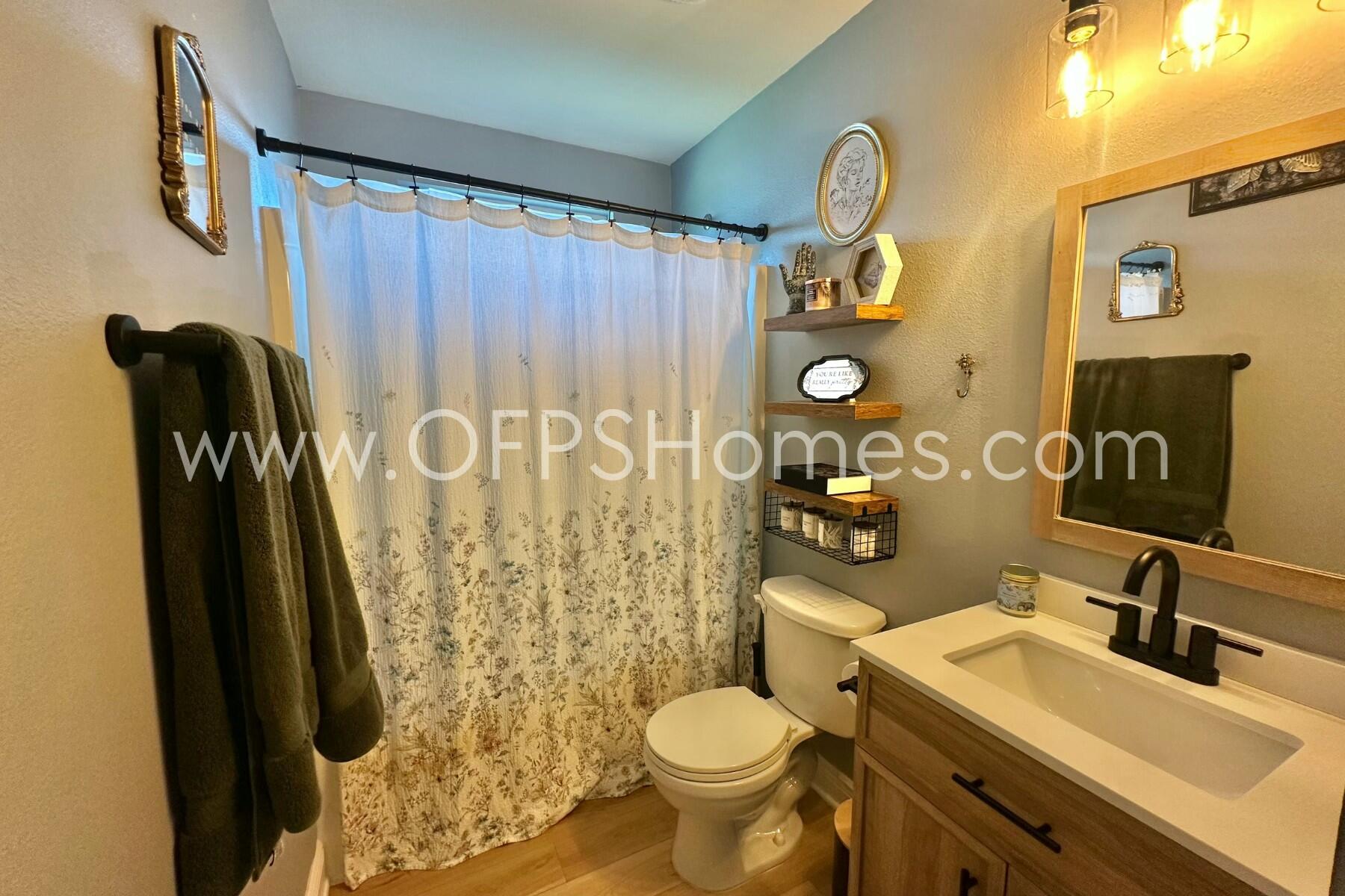 2400 Avenida De Sol Navarre, FL 32566 - Photo 23 of 42 a bathroom with a sink toilet and shower