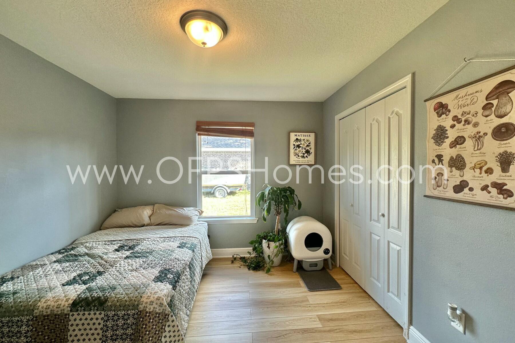 2400 Avenida De Sol Navarre, FL 32566 - Photo 25 of 42 a bedroom with a bed and a window