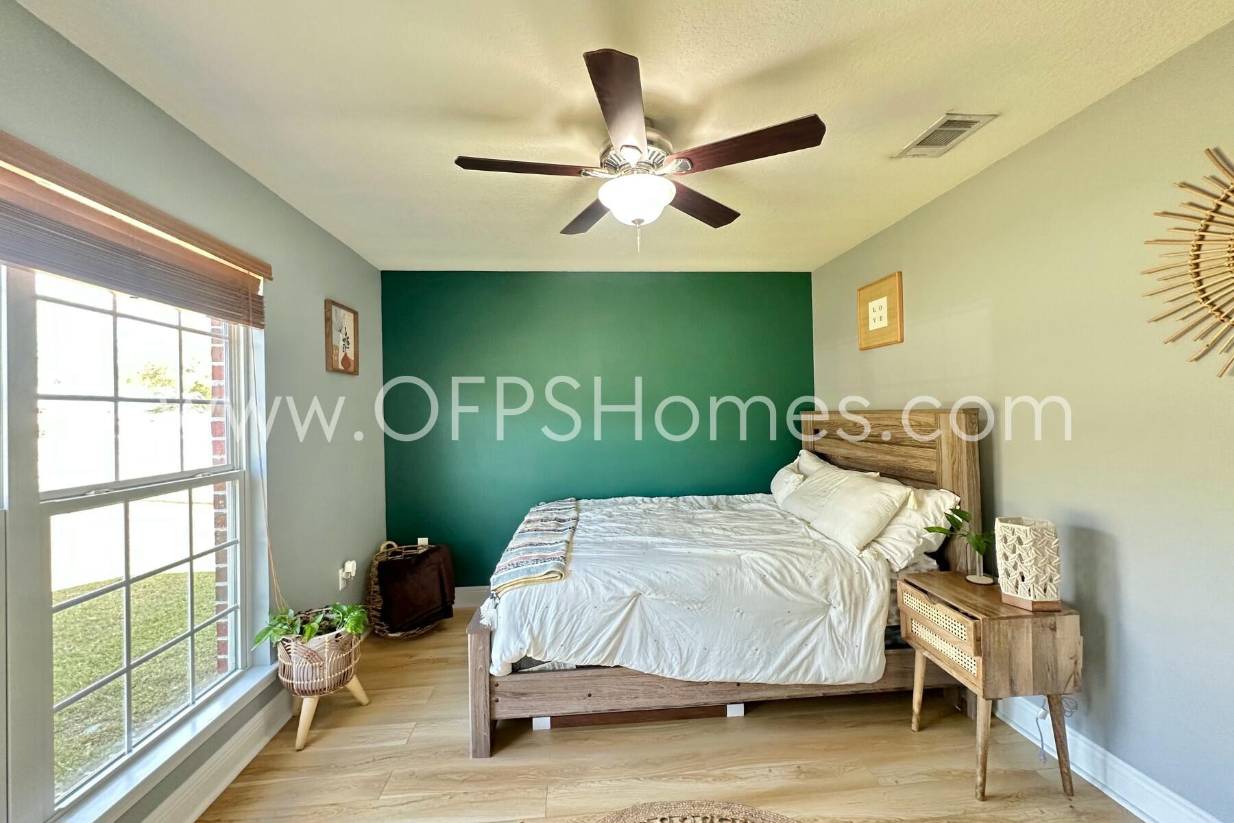 2400 Avenida De Sol Navarre, FL 32566 - Photo 28 of 42 a bedroom with a bed and a window