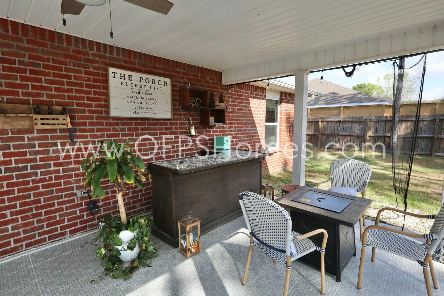 2400 Avenida De Sol Navarre, FL 32566 - Photo 31 of 42 a dining room with furniture and floor to ceiling window
