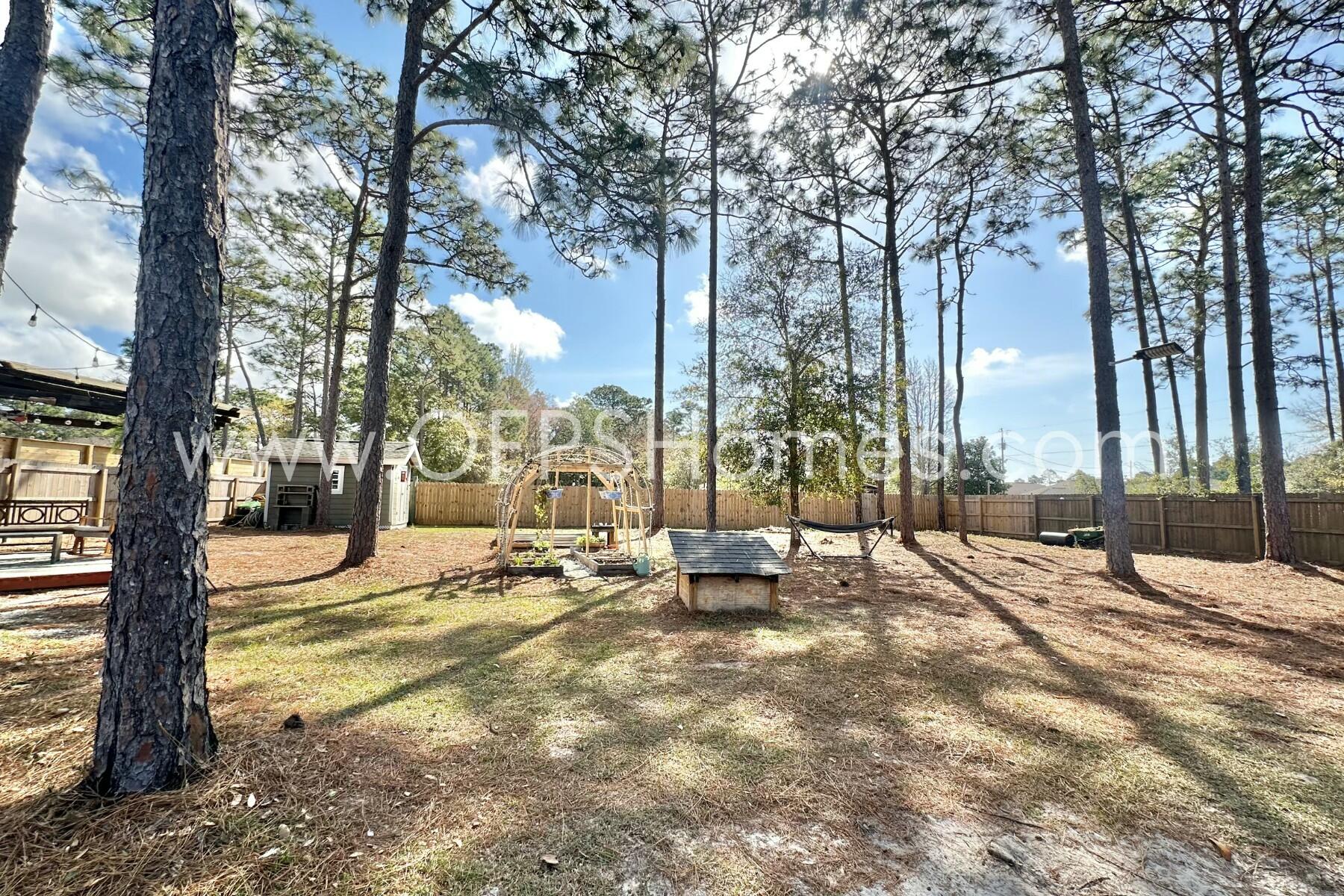 2400 Avenida De Sol Navarre, FL 32566 - Photo 33 of 42 a view of a outdoor space with a patio