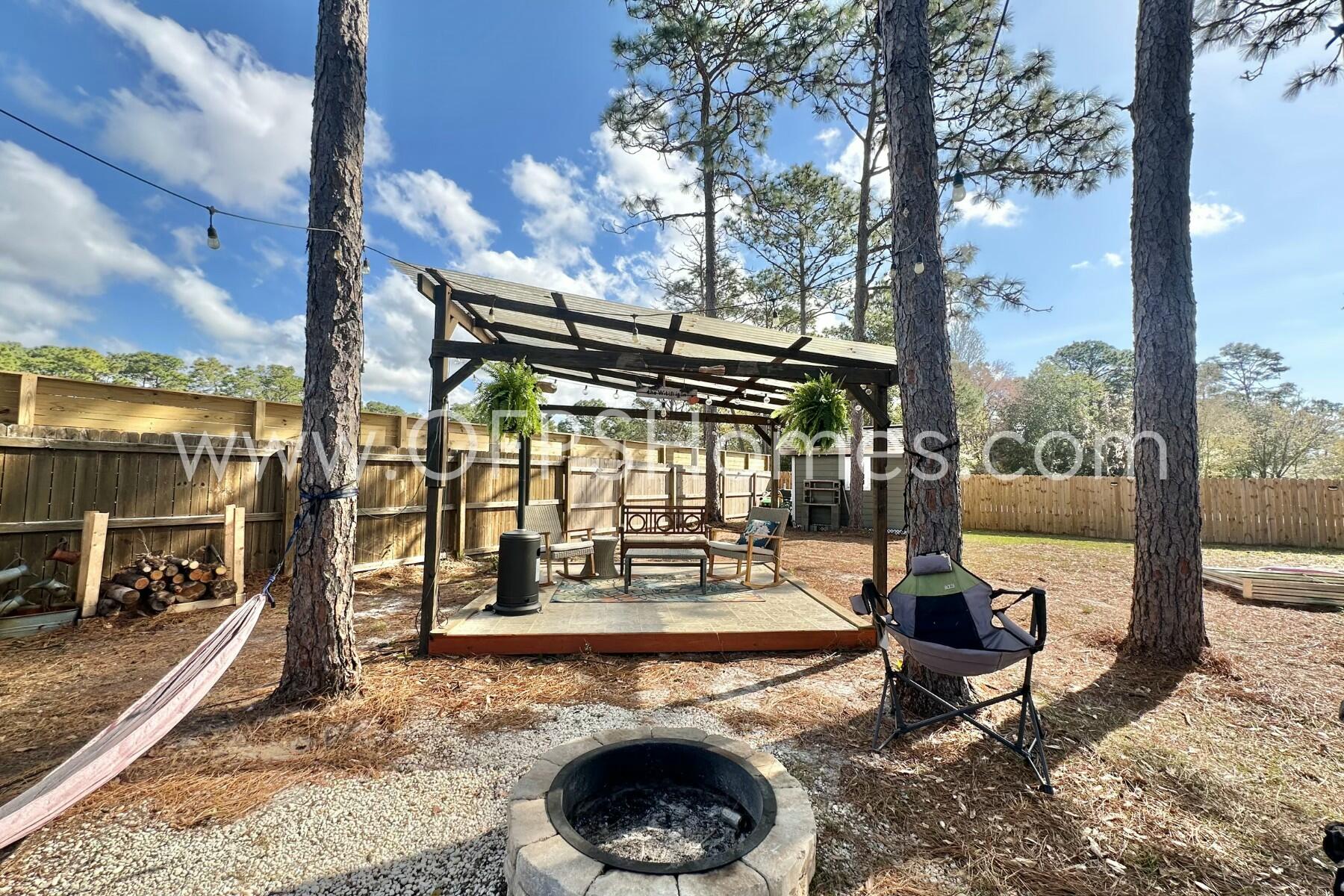2400 Avenida De Sol Navarre, FL 32566 - Photo 34 of 42 a view of a swimming pool with a patio