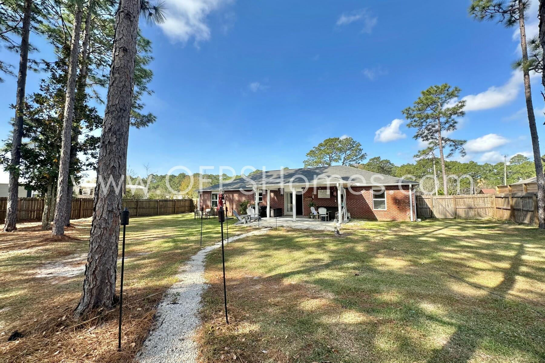 2400 Avenida De Sol Navarre, FL 32566 - Photo 36 of 42 a view of a house with a yard