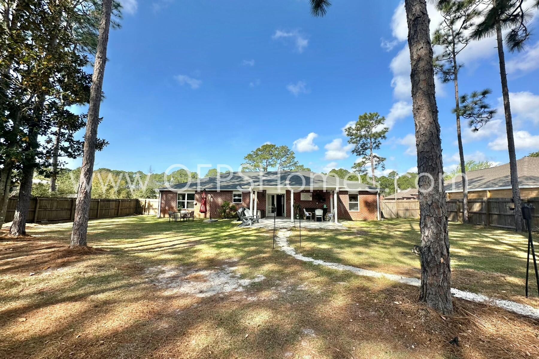 2400 Avenida De Sol Navarre, FL 32566 - Photo 37 of 42 a view of a house with a big yard