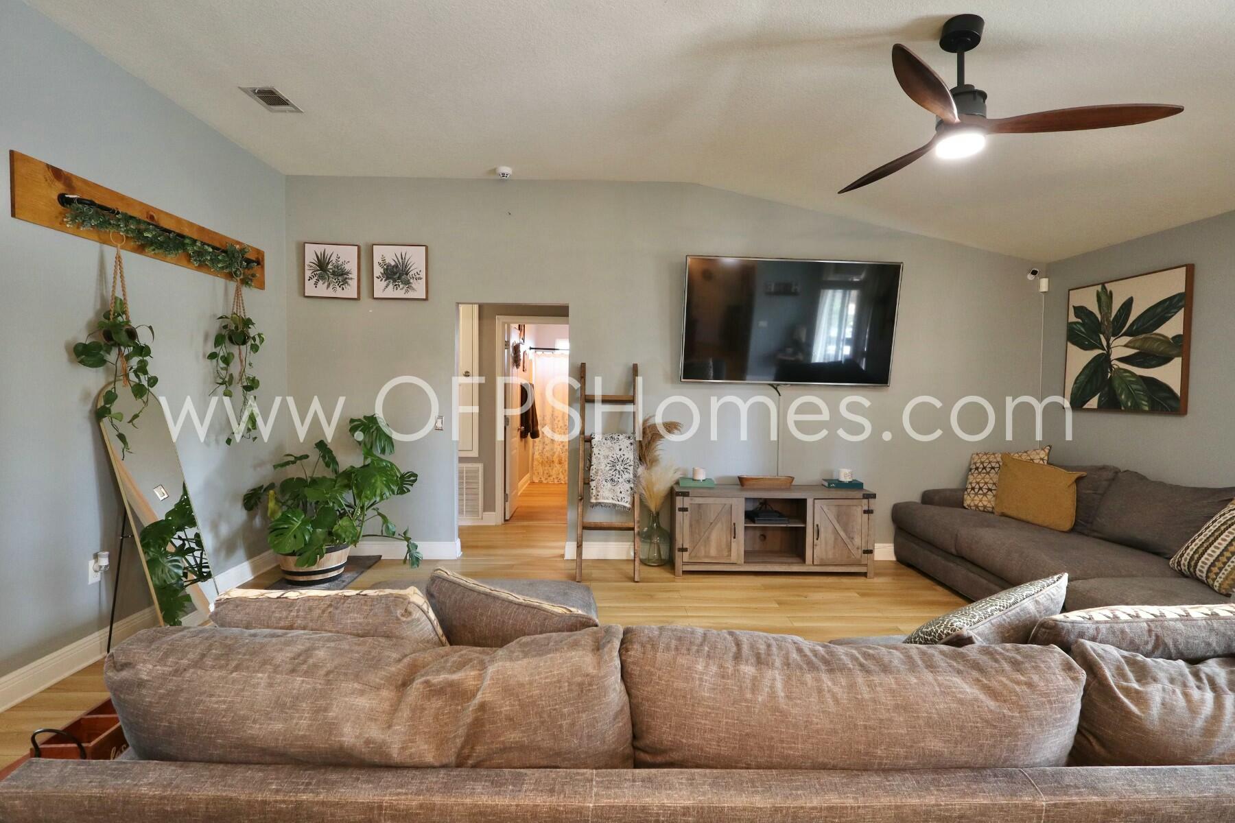 2400 Avenida De Sol Navarre, FL 32566 - Photo 7 of 42 a living room with furniture and a fireplace