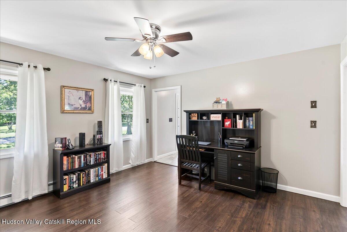 29 Stone Mountain Road Round Top, NY 12473 - Photo 14 of 36 a view of a workspace with furniture and wooden floor
