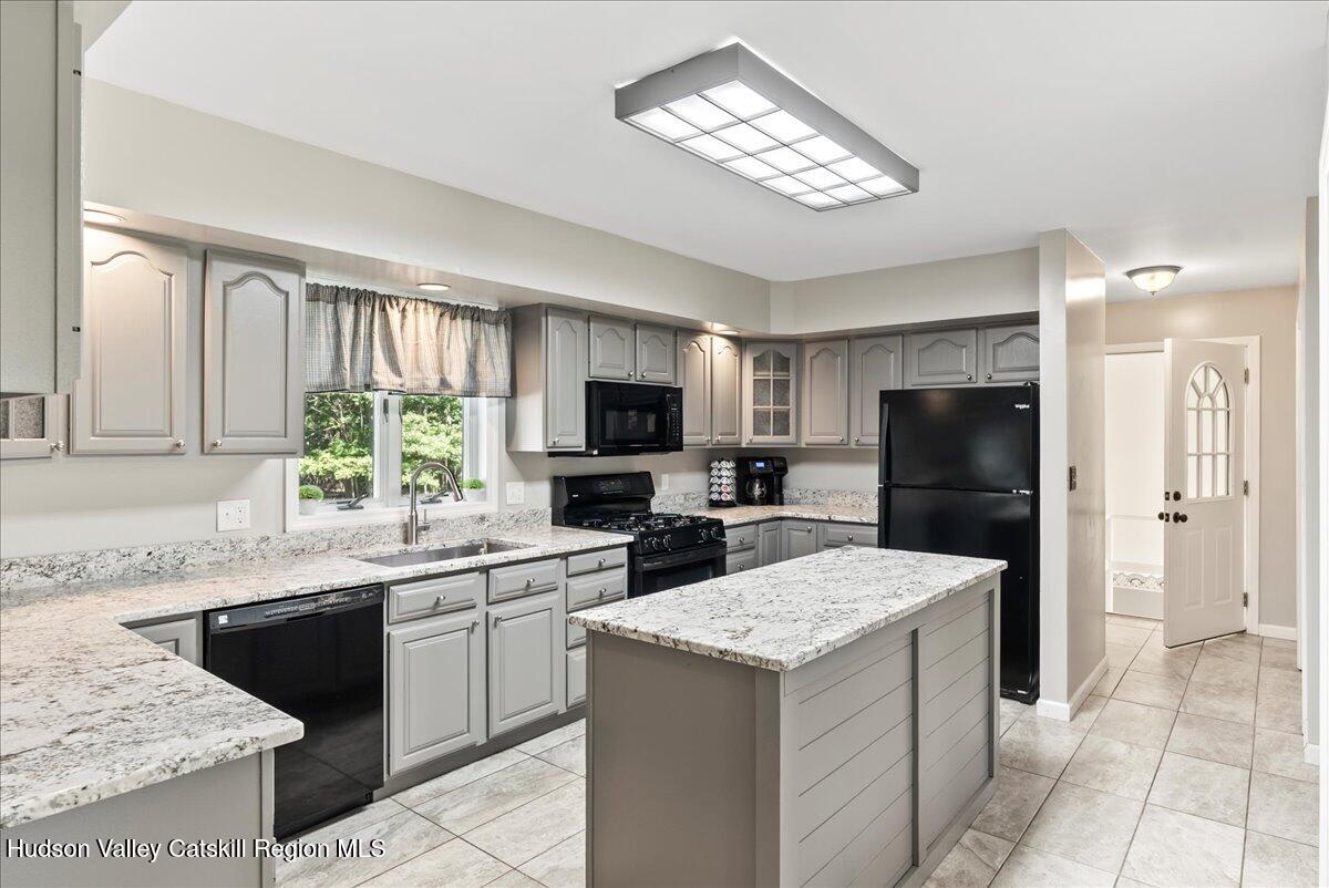 29 Stone Mountain Road Round Top, NY 12473 - Photo 2 of 36 a kitchen with a sink stove and refrigerator