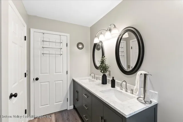 a bathroom with a sink and a mirror