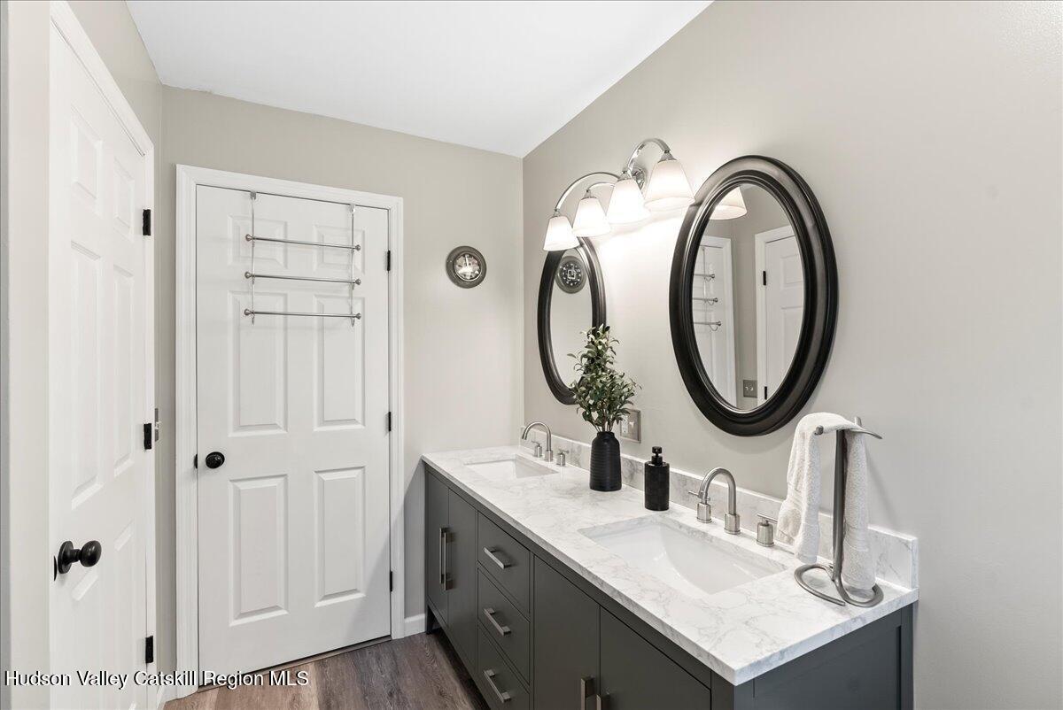 29 Stone Mountain Road Round Top, NY 12473 - Photo 22 of 36 a bathroom with a sink and a mirror