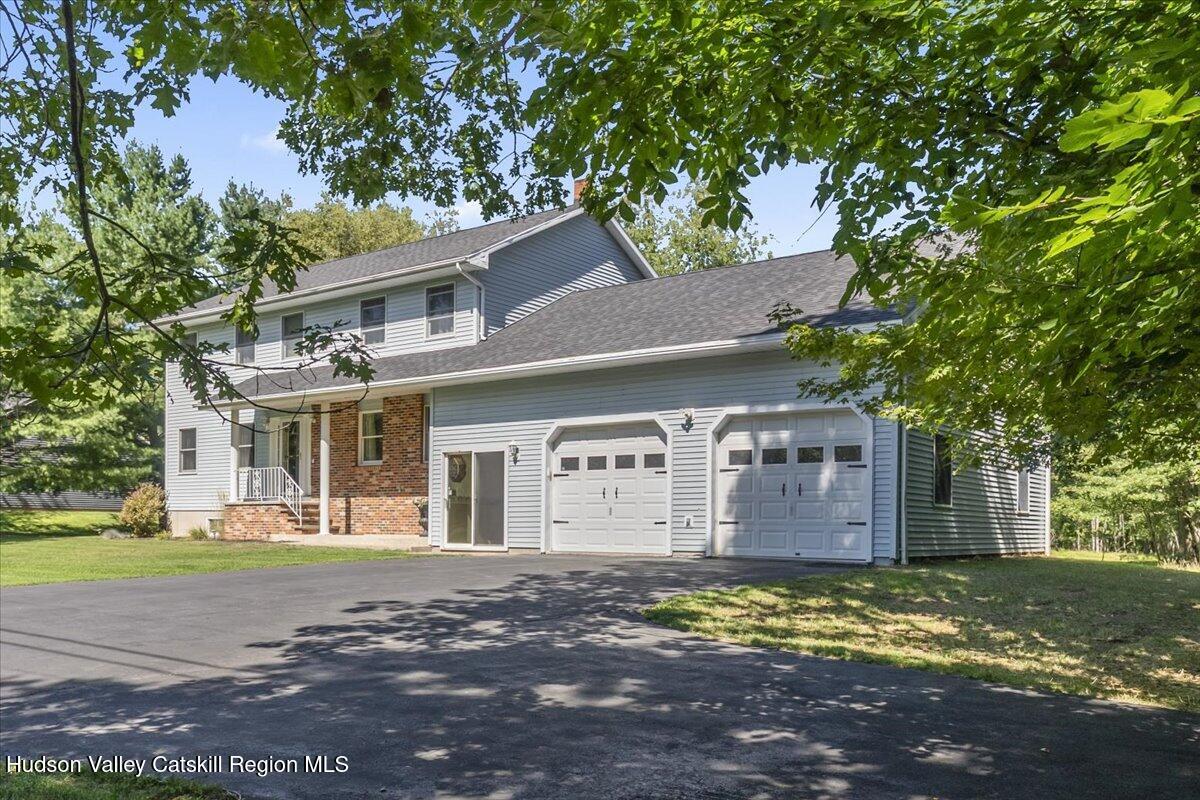29 Stone Mountain Road Round Top, NY 12473 - Photo 35 of 36 a front view of a house with a yard