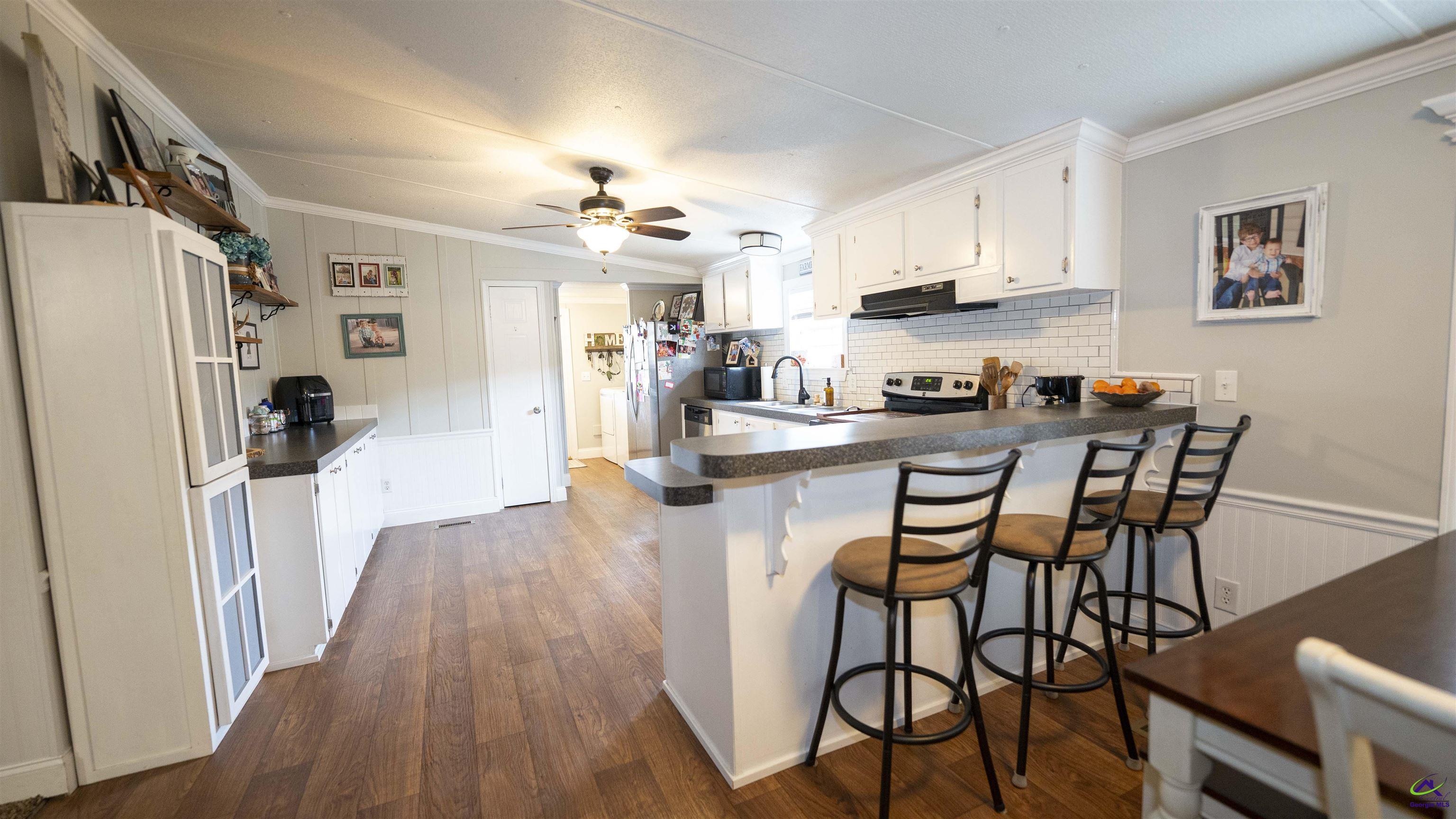 500 Old Milledgeville Road Cochran, GA 31014 - Photo 33 of 48 a view of a dining room with furniture and wooden floor