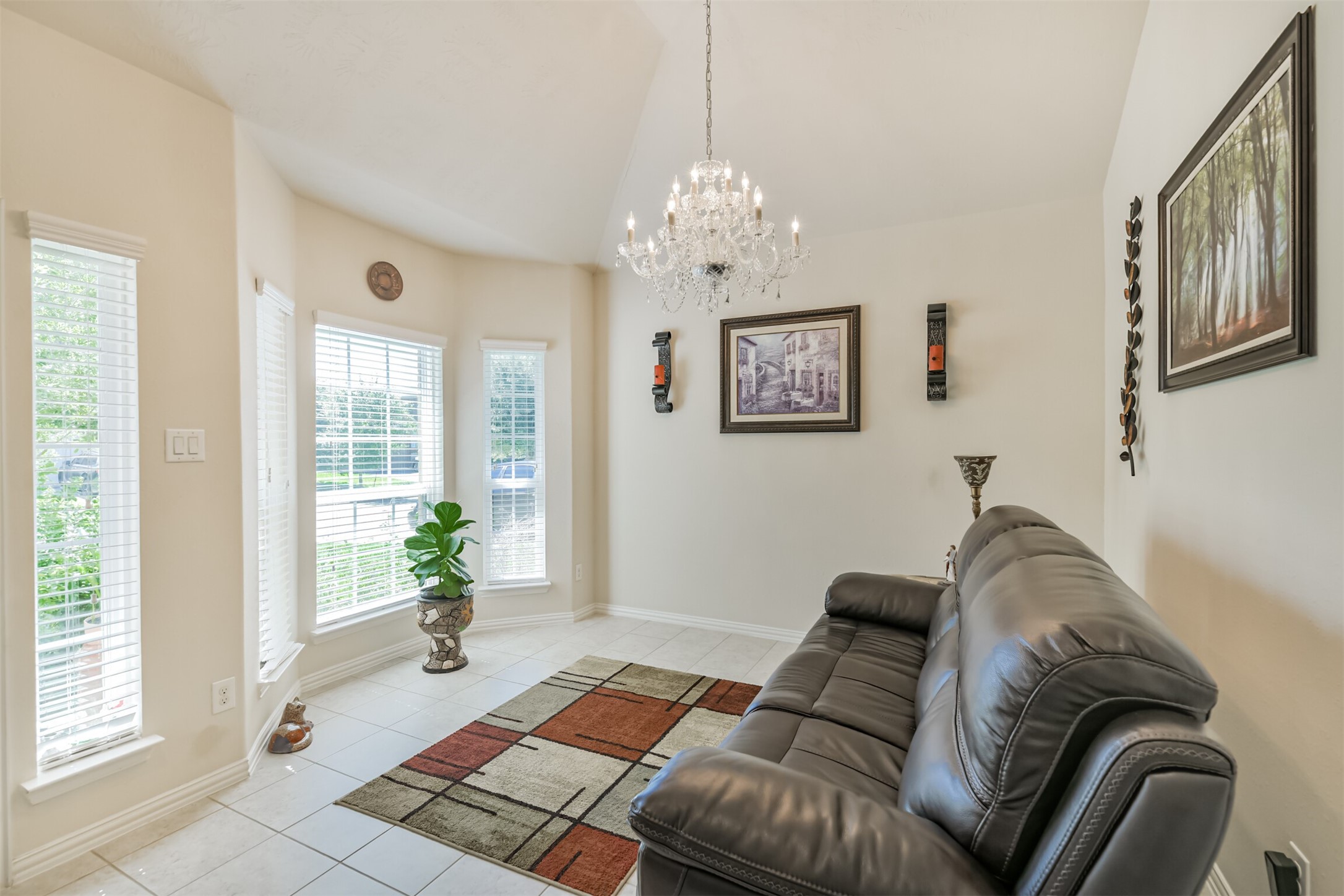 7527 Windsor Valley Lane Houston, TX 77049 - Photo 7 of 35 a living room with furniture and a chandelier