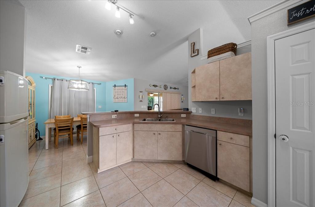 5321 Southwest 115th Loop Ocala, FL 34476 - Photo 23 of 49 a kitchen with sink and chairs