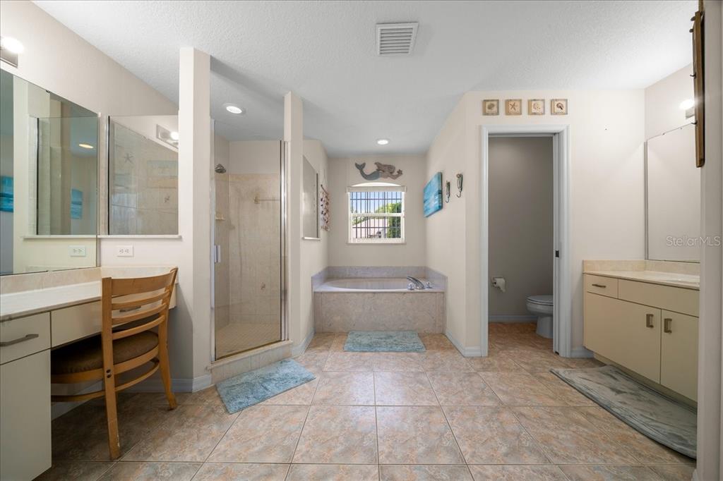 5321 Southwest 115th Loop Ocala, FL 34476 - Photo 29 of 49 a bathroom with a sink a toilet and shower