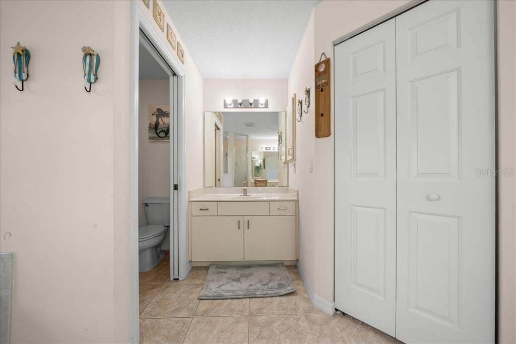 5321 Southwest 115th Loop Ocala, FL 34476 - Photo 31 of 49 a bathroom with a granite countertop sink and a mirror