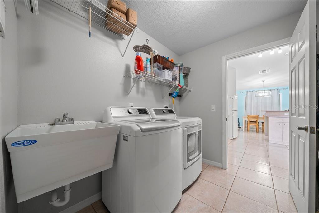 5321 Southwest 115th Loop Ocala, FL 34476 - Photo 38 of 49 a utility room with dryer and washer