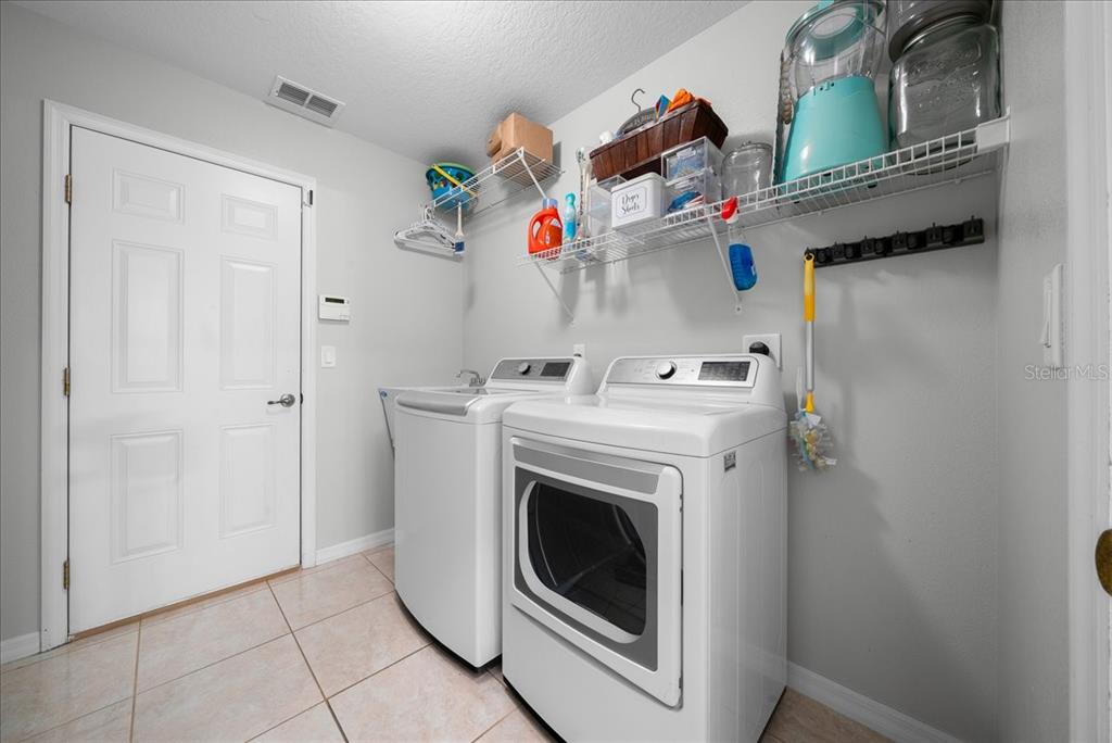 5321 Southwest 115th Loop Ocala, FL 34476 - Photo 39 of 49 a utility room with dryer and washer