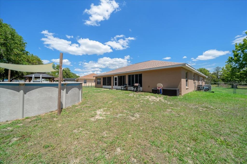 5321 Southwest 115th Loop Ocala, FL 34476 - Photo 46 of 49 a view of a house with a yard